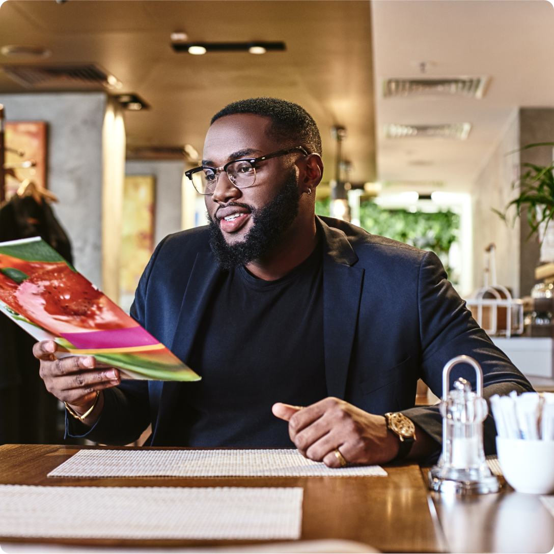 Man holding a menu